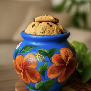 Hand-painted terracotta pot with blue background and orange flower design