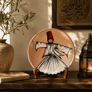 Hand-painted Sufi terracotta decorative plate featuring a whirling dervish in warm neutral tones