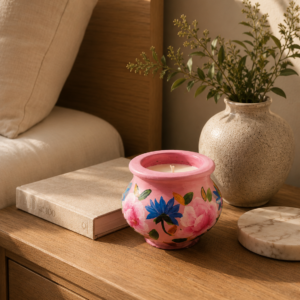 Hand-painted pink terracotta candle pot with peony and cornflower floral design